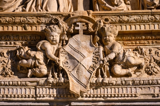 sculpture of angels and coat of arms