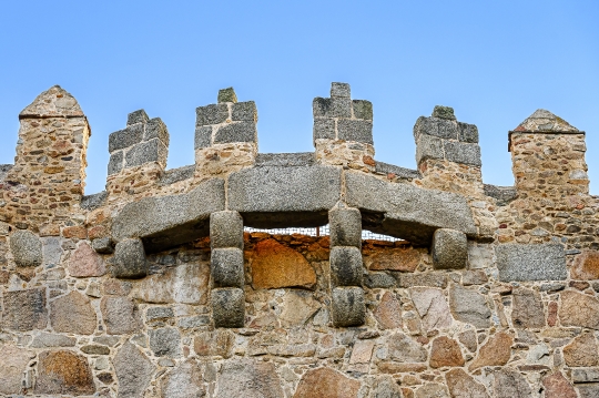 Semi-circular stone structure that is part of a medieval fortifi