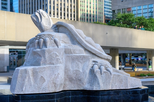 Side view of a stone sculpture of a turtle in the Spirit Garden 