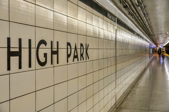 Sign on the tiled wall of High Park subway station.