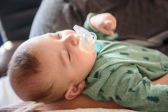 Sleeping baby with a pacifier