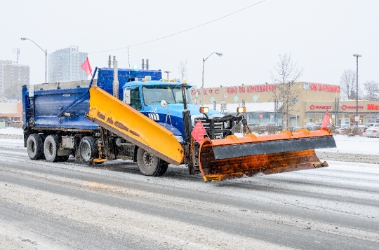 Snow Clearing Truck in City Street