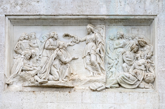 Stone bas-relief sculpture in the Plaza del Palacio Real, Madrid