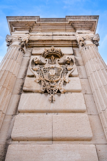 Stone coat of arms in the exterior of the Royal Palace.