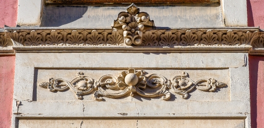 Stone decorations on an ancient building facade, Alicante, Spain