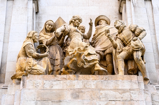 Stone sculptures part of the Cervantes Monument, a famous place