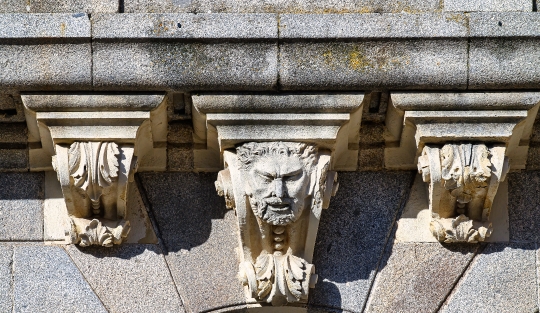 Stone support structure with decorative elements on the facade o