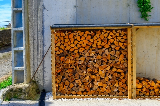 Stored Firewood by a Rural House