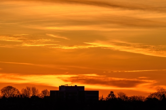 Sunrise over cityscape with no people.