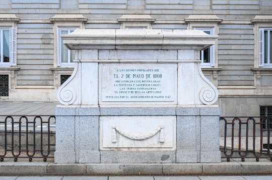 Text information sign in a wall of the Royal Palace, it honors t