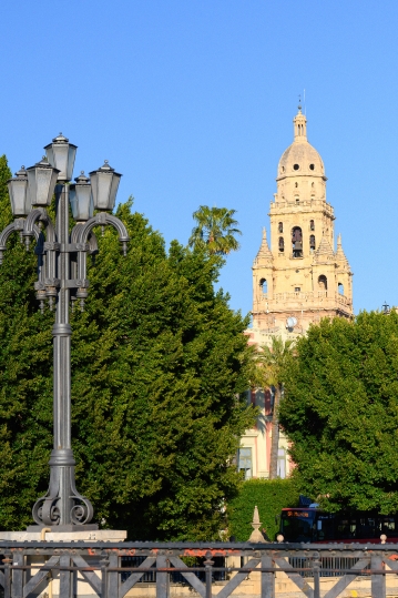 The ancient bell tower of the cathedral framed by an old-fashion
