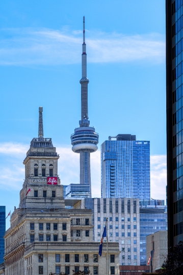 The CN Tower and the Canada Life Building in the downtown distri