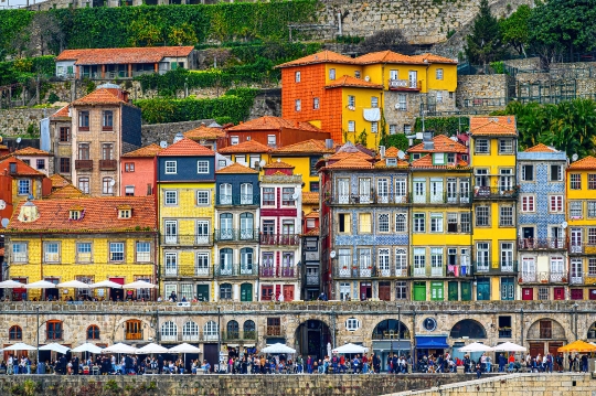 Tourists in the waterfront district, with beautiful building fac