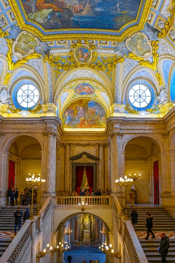 Tourists sightseeing the lobby of the Royal Palace.