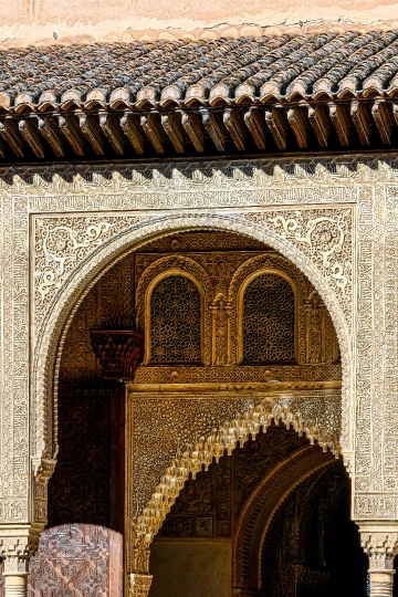 Two arches with different islamic architectural styles