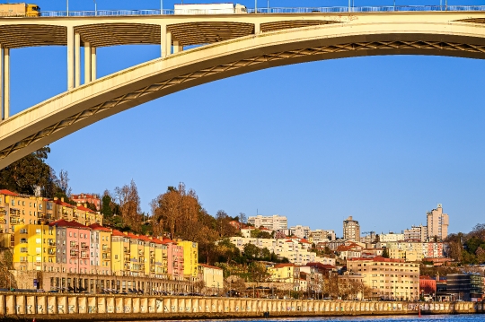 Urban cityscape and skyline framed by the Arrabida Bridge over t