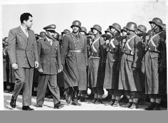 Vice President Richard Nixon reviews an honor guard upon arrival