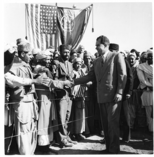 Vice President Richard Nixon shakes hands with locals in Afganis