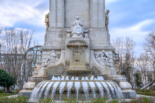 Water flowing in the fountain of the Cervantes Monument, Madrid,