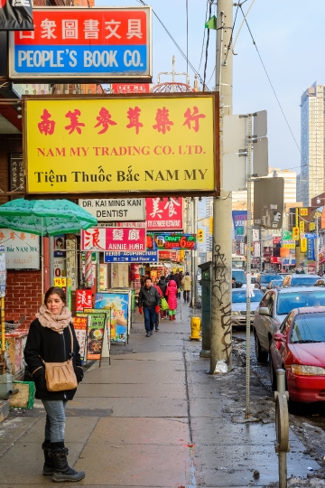 Woman And Signs in Chinatown