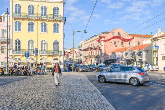 Woman Crossing Street in Belem District